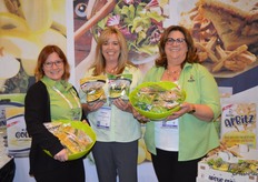 Jessica Brady, Rebecca Catlett and Jeanetter De-Coninck-Hertzler show Arctic Golden and Arctic Granny Apbitz dried apples.